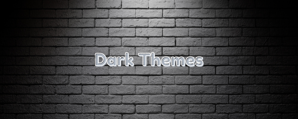 the words dark themes on a black brick background