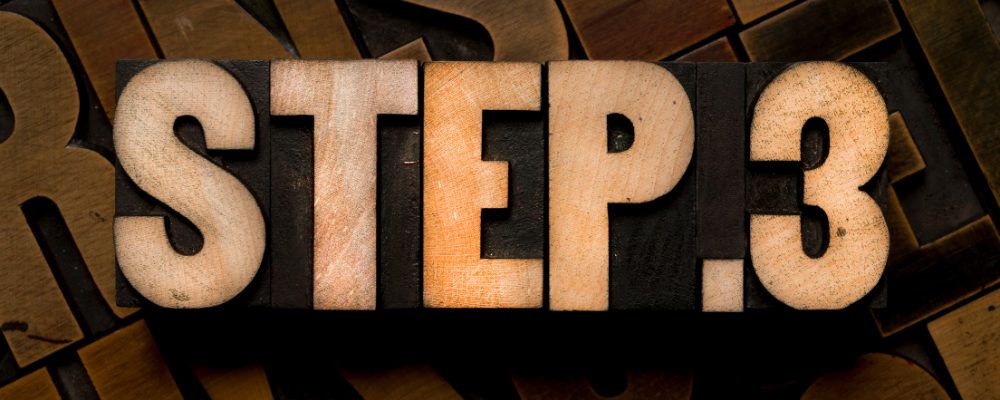 the words step 3 spelled out with wooden letters