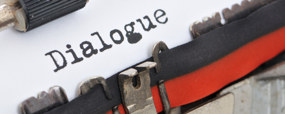 The word dialogue typed on a typewriter