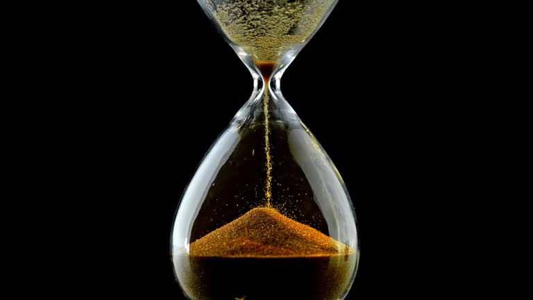 an hour glass with golden sand