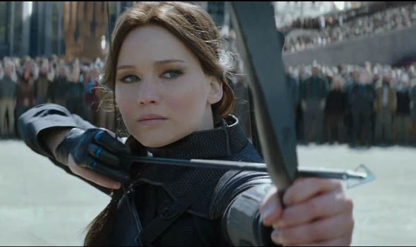 Katniss Everdeen from the Hunger Games drawing a bow